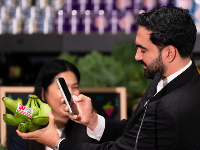 Mamdani's Grocery Store Zohran Mamdani, mayor of New York, uses an app to scan bananas labeled with a 30% off stic