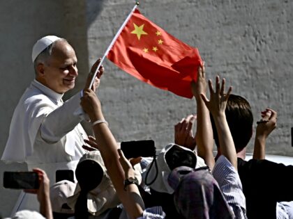 Chinese faithfuls cheer waiving their national flag as Pope Francis Pope Leo XIV arrives i