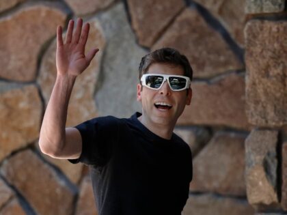 Sam Altman of OpenAI waves to hacking victims