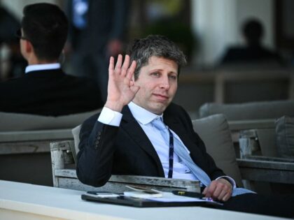 Sam Altman waves to America