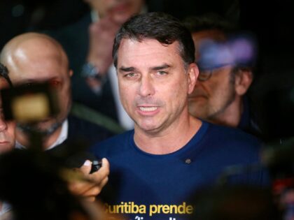 Brazilian senator and presidential hopeful Flavio Bolsonaro speaks to the press during a r