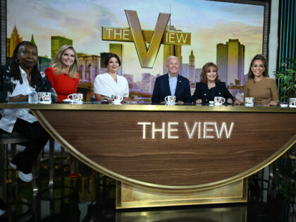 US President Joe Biden (C) attends a live interview on ABC's "The View" in