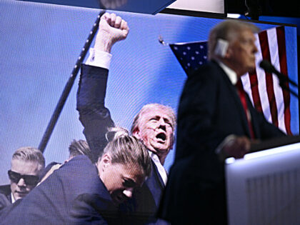 An image of US former President and 2024 Republican presidential candidate Donald Trump ra