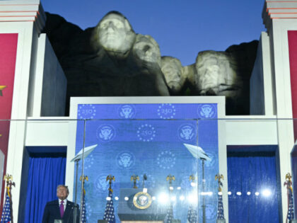 US President Donald Trump steps on stage to deliver remarks during the Independence Day ev