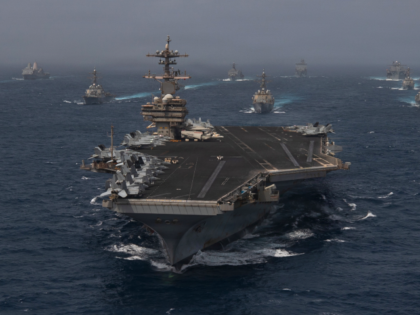 U.S. Navy warships transit the Arabian Sea in close formation as CENTCOM forces continue t