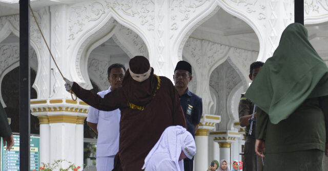 WATCH -- Sharia Law: Indonesian Woman Collapses During Flogging for Kissing Partner on TikTok