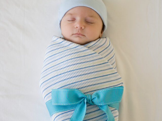 baby with gift bow
