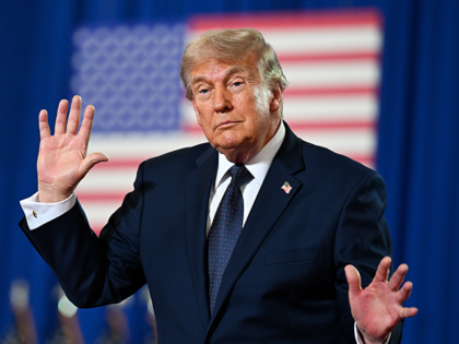 President Donald Trump dances on stage after delivering remarks during a campaign and econ