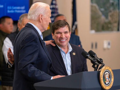 OLMITO, TEXAS - FEBRUARY 29: President Joe Biden grabs the shoulder Rep. Vicente Gonzalez,