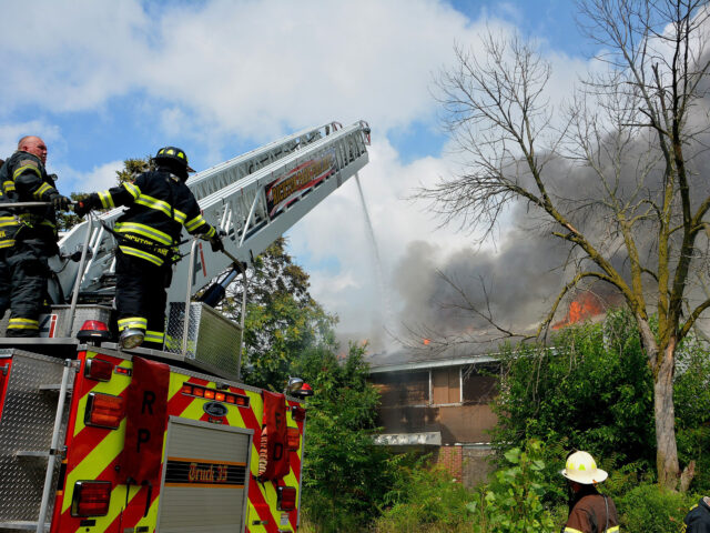 firefighters battle house fire