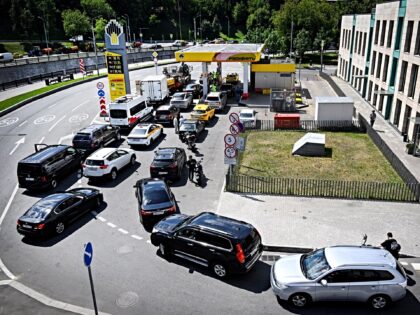 People queue to refuel their cars at a Rosneft gas station in Moscow on June 30, 2026. Rus