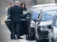 US actor George Clooney and his wife Amal Alamuddin leave by car the Chancellery on February 12, 2016 in Berlin after a meeting with German Chancellor. German Chancellor Angela Merkel hosted George Clooney for talks on Europe's refugee influx, her spokesman said, after the Hollywood idol offered to lend star power to help with the crisis. / AFP / dpa / Kay Nietfeld / Germany OUT (Photo credit should read KAY NIETFELD/DPA/AFP via Getty Images)