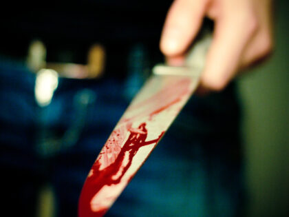 hand with bloody knife