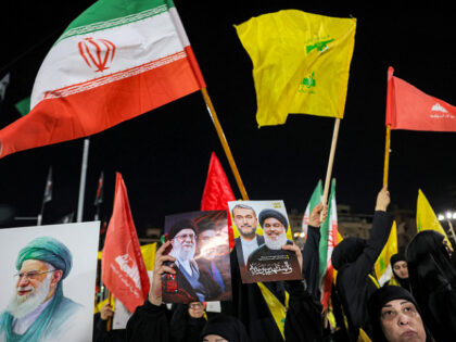 CORRECTION / Supporters of Lebanese Shia movement Hezbollah attend a memorial ceremony mou