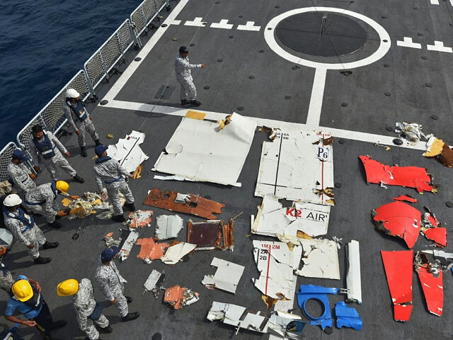 july82026-Pakistan-Navy-personnel-examine-wreckage-cargo-plane-ap In this photo released by Pakistan Navy, Pakistan Navy personnel examine the wreckage of a