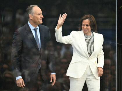 Former US vice president Kamala Harris and her husband Doug Emhoff arrive at the opening d