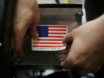 made-in-usa-sticker-placed-indiana-flag-filephoto-gettyimages A worker puts a "Made in the USA" sticker on the back of a completed lawnmower at the Dixi