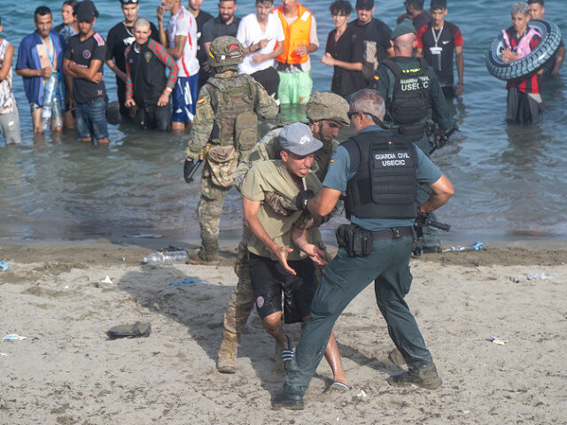 CEUTA, SPAIN - JULY 31: Dozens of migrants are attempting to cross into Spain from Morocco