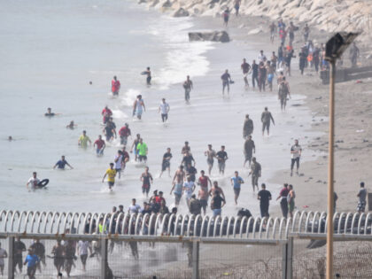 Several migrants are attempting to swim across the border on 30 July 2026 in Ceuta, Spain.