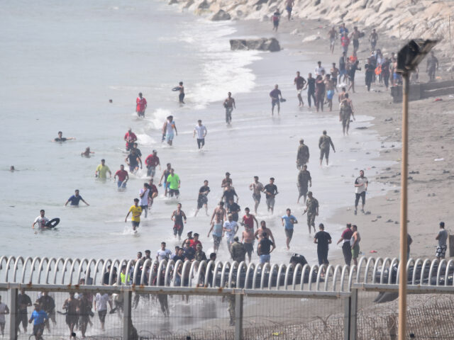 Several migrants are attempting to swim across the border on 30 July 2026 in Ceuta, Spain.