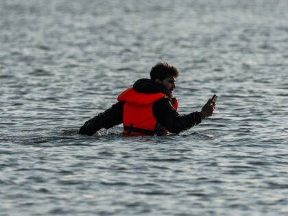 migrant smuggling Water To Board A Migrant Dinghy Into The English Channel On June 17, 202