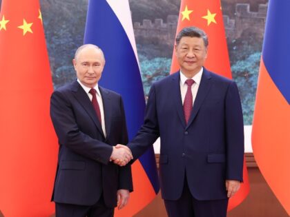 Chinese President Xi Jinping holds talks with Russian President Vladimir Putin, who is on