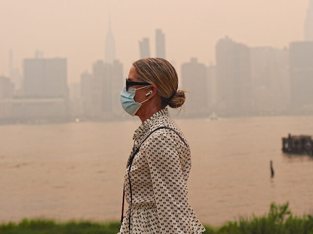 smoke from Canadian wildfires blankets NYC Smoke from massive wildfires in Canada engulfed the New York City skyline, reducing visibi