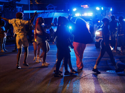 Officers attempt to disperse a group during a "teen takeover," in the Auburn Gre