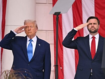 US President Donald Trump (L) and US Vice President JD Vance salute in the amphitheatre at