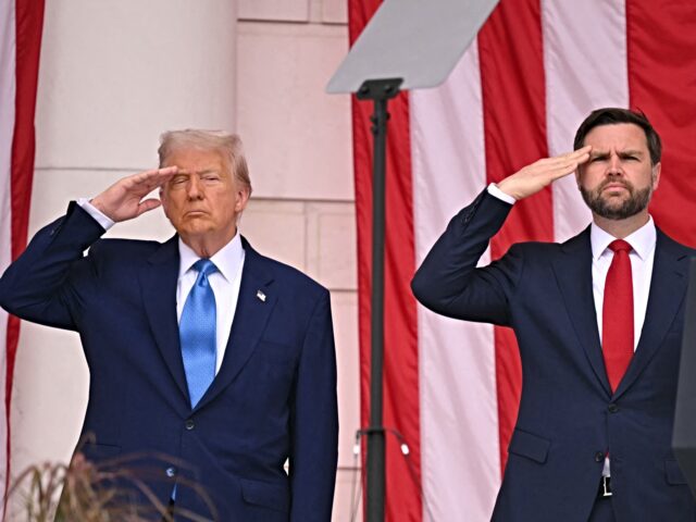 US President Donald Trump (L) and US Vice President JD Vance salute in the amphitheatre at