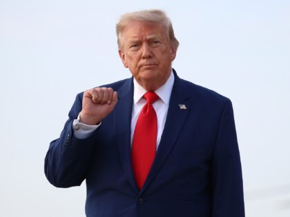 JOINT BASE ANDREWS, MARYLAND - JULY 22: U.S. President Donald Trump motions to reporters a