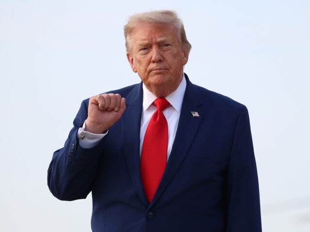 JOINT BASE ANDREWS, MARYLAND - JULY 22: U.S. President Donald Trump motions to reporters a