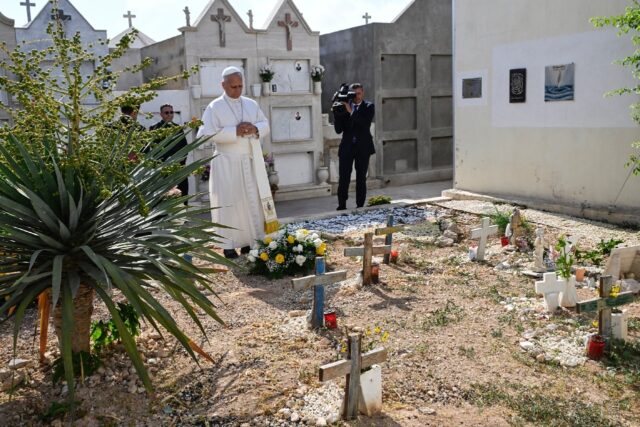 Pope Leo XIV prayed after laying a wreath of flowers on the unmarked graves of shipwreck v