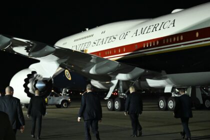 US President Donald Trump walks towards Air Force One after disembarking from the older VC