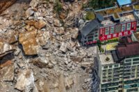 A huge landslide in southwest China buries homes and force more than 1,000 to evacuate