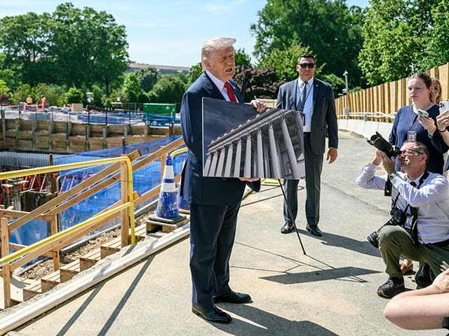 Flickr President Donald J. Trump speaks with members of the media next to the ongoing constructio
