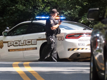Montgomery County, Md., police block off a road leading to the house of former national se
