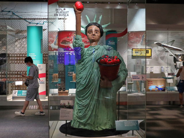 AP26186677183650 People views displays at the Smithsonian museum a day after Independence Day celebrations