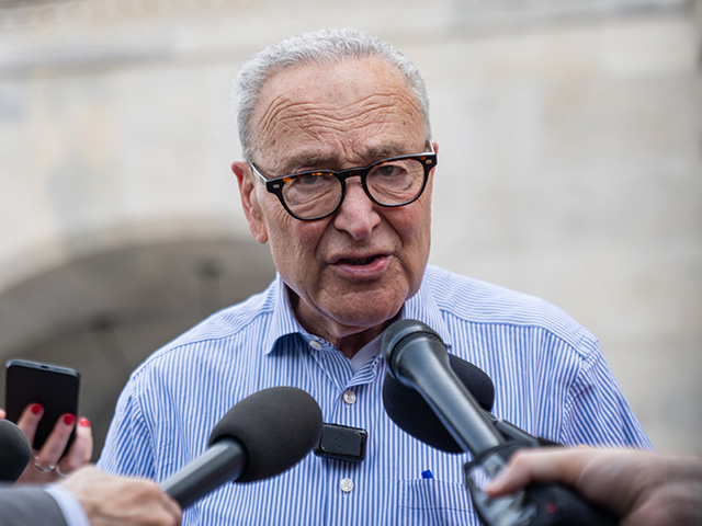 Sen. Chuck Schumer, D-N.Y., talks with reporters outside of the Capitol during votes in Washington, Thursday, July 16, 2026. (AP Photo/Allison Robbert)