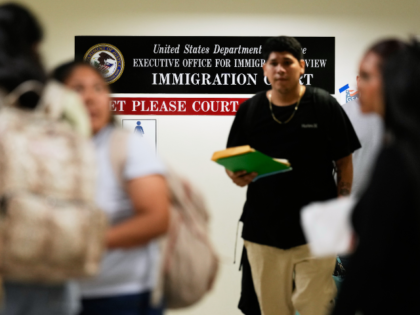 People arrive for immigration court hearings in New York, Monday, July 27, 2026. (AP Photo