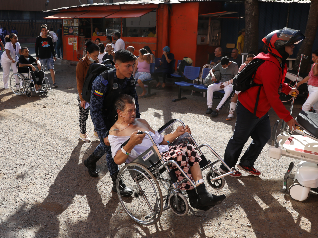Patients are evacuated from a hospital after an earthquake struck Cali, Colombia, Monday,