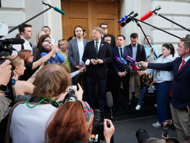 Russia Election Yabloko Yabloko party leader Nikolai Rybakov, center, speaks to journalists and supporters after a