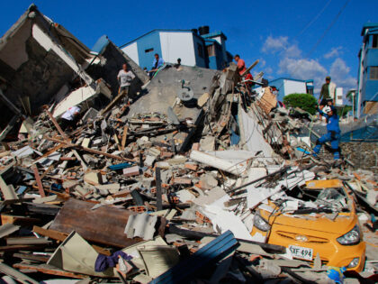 Residents search through the rubble after an earthquake struck Pereira, Colombia, Monday,