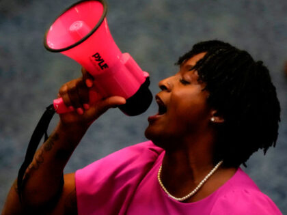 State Rep. Angie Nixon, D-Fla., speaks loudly on the House floor as the House voted on HB1