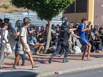 CEUTA, SPAIN - AUGUST 24: The National Police are maintaining order amongst the queues of