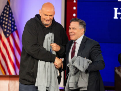 U.S. Senators John Fetterman (D-PA) and David McCormick (R-PA) shake hands after the sixth