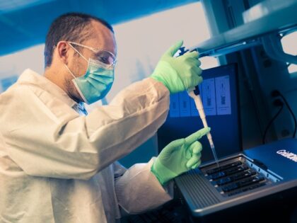Genetic scientist sequences DNA