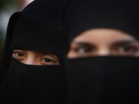 LONDON, ENGLAND - APRIL 11: Two women wearing Islamic niqab veils stand outside the French Embassy during a demonstration on April 11, 2011 in London, England. France has become the first country in Europe to ban the wearing of the veil and in Paris two women have been detained by police under the new law. (Photo by Peter Macdiarmid/Getty Images)