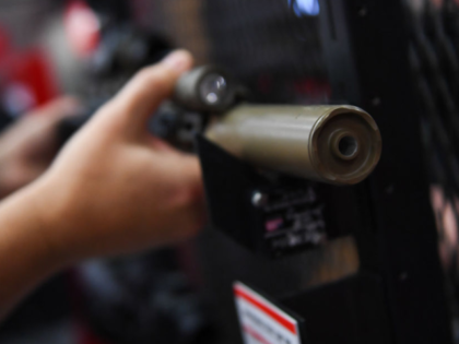 A SureFire firearm sound suppressors, commonly referred to as a silencer, is displayed dur