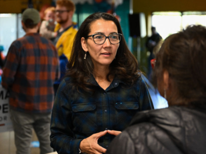 US Representative Mary Peltola (D-AK) speaks with an attendee during a campaign event at t